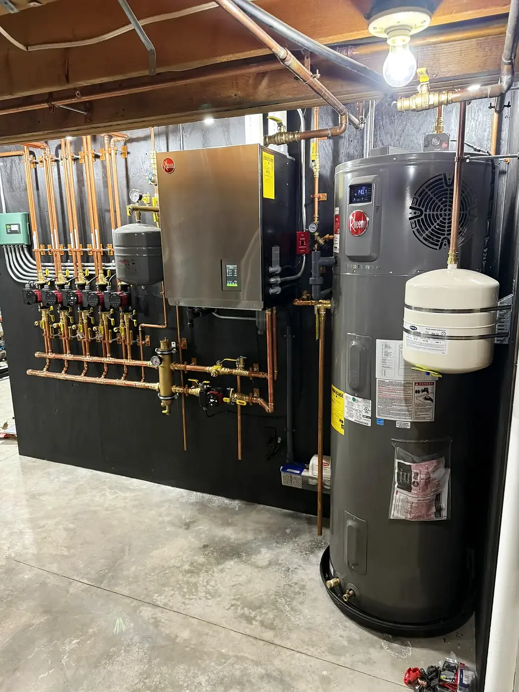Full mechanical room install — boiler, manifold, and water heater — by MPS207